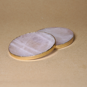 Rose quartz remains with a gold-plated edge